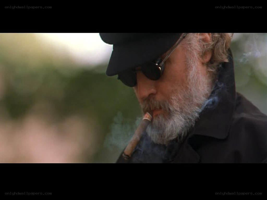 man smoking cigar outdoors