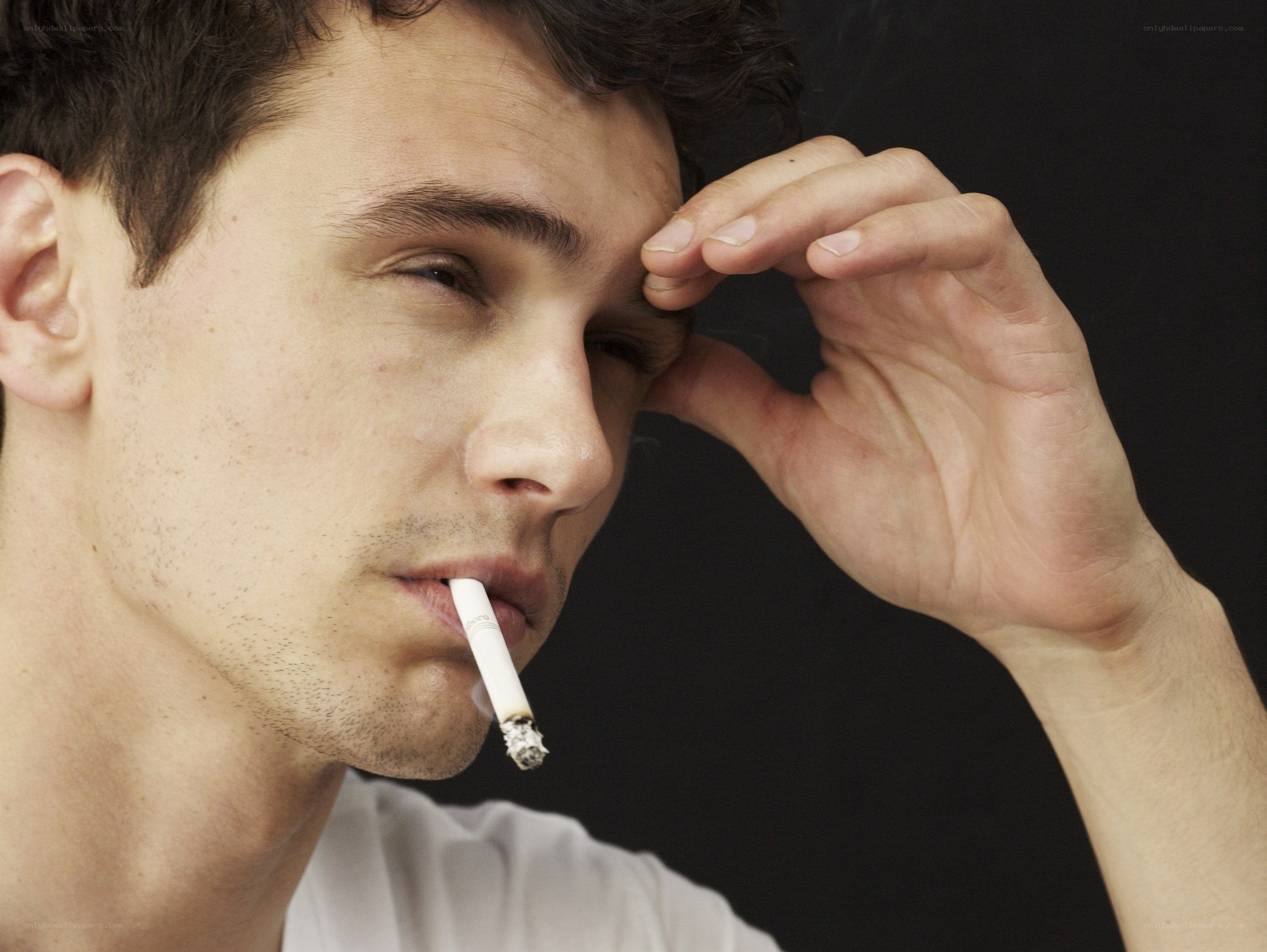 man smoking cigarette