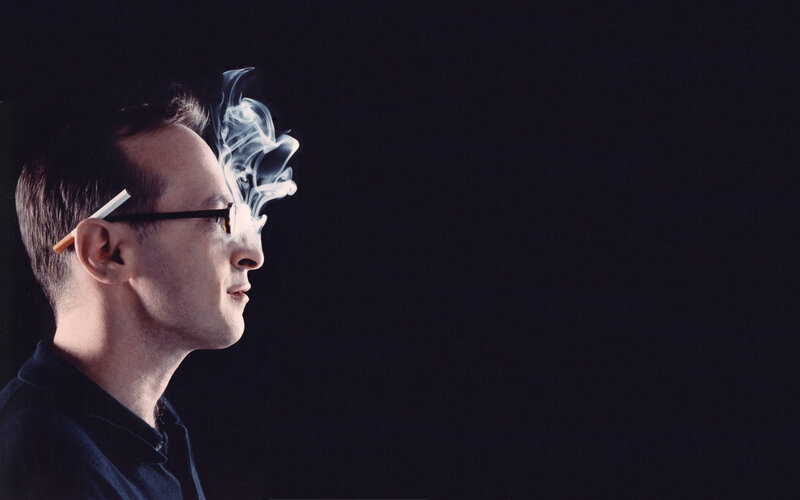 man smoking cigarette