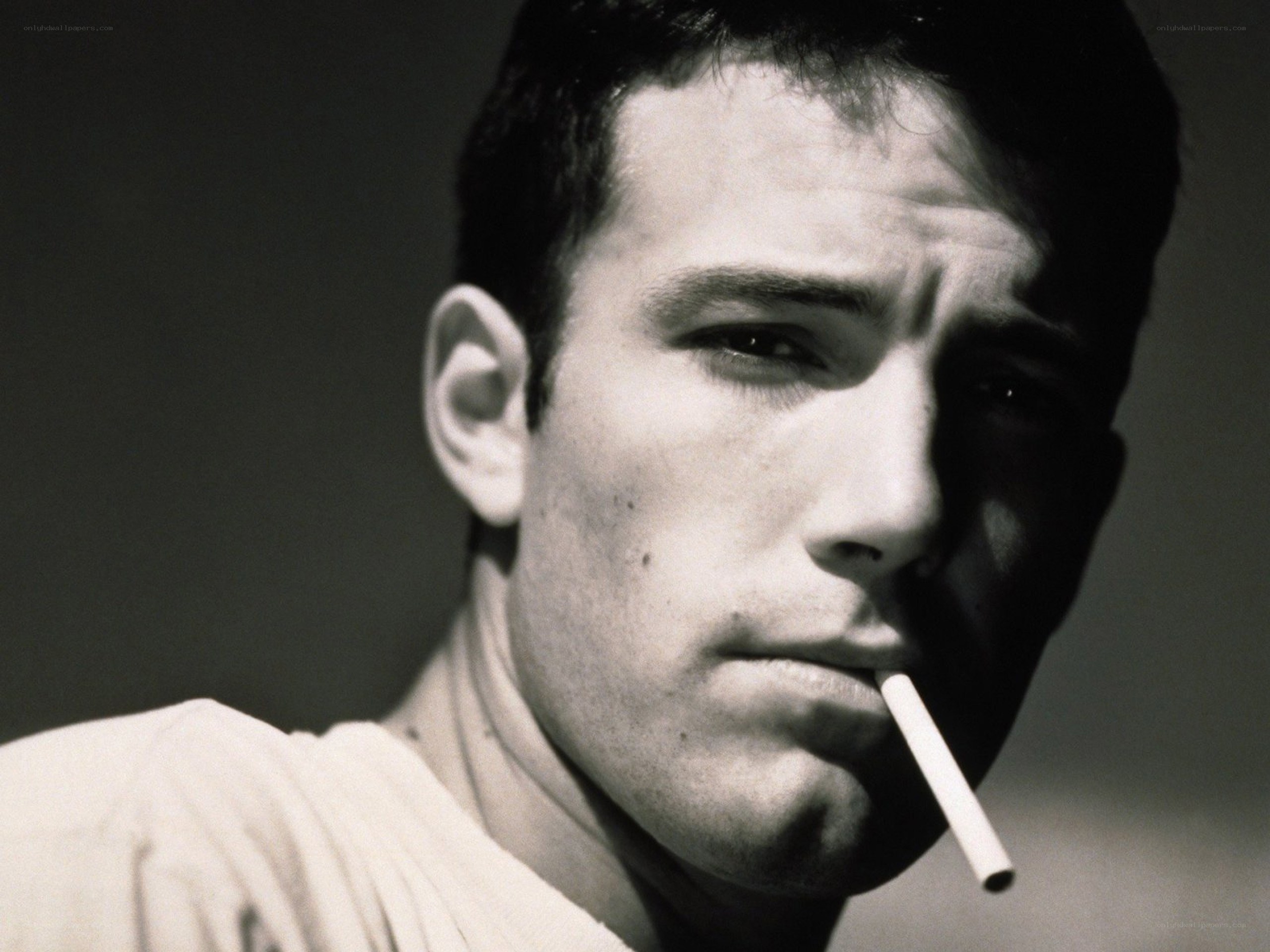 man smoking cigarette