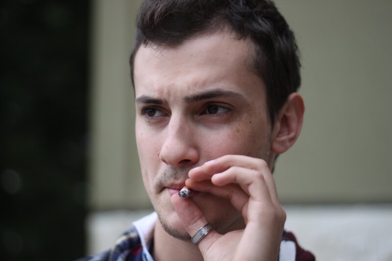 Man Smoking Cigarette — Brown, Contemplative