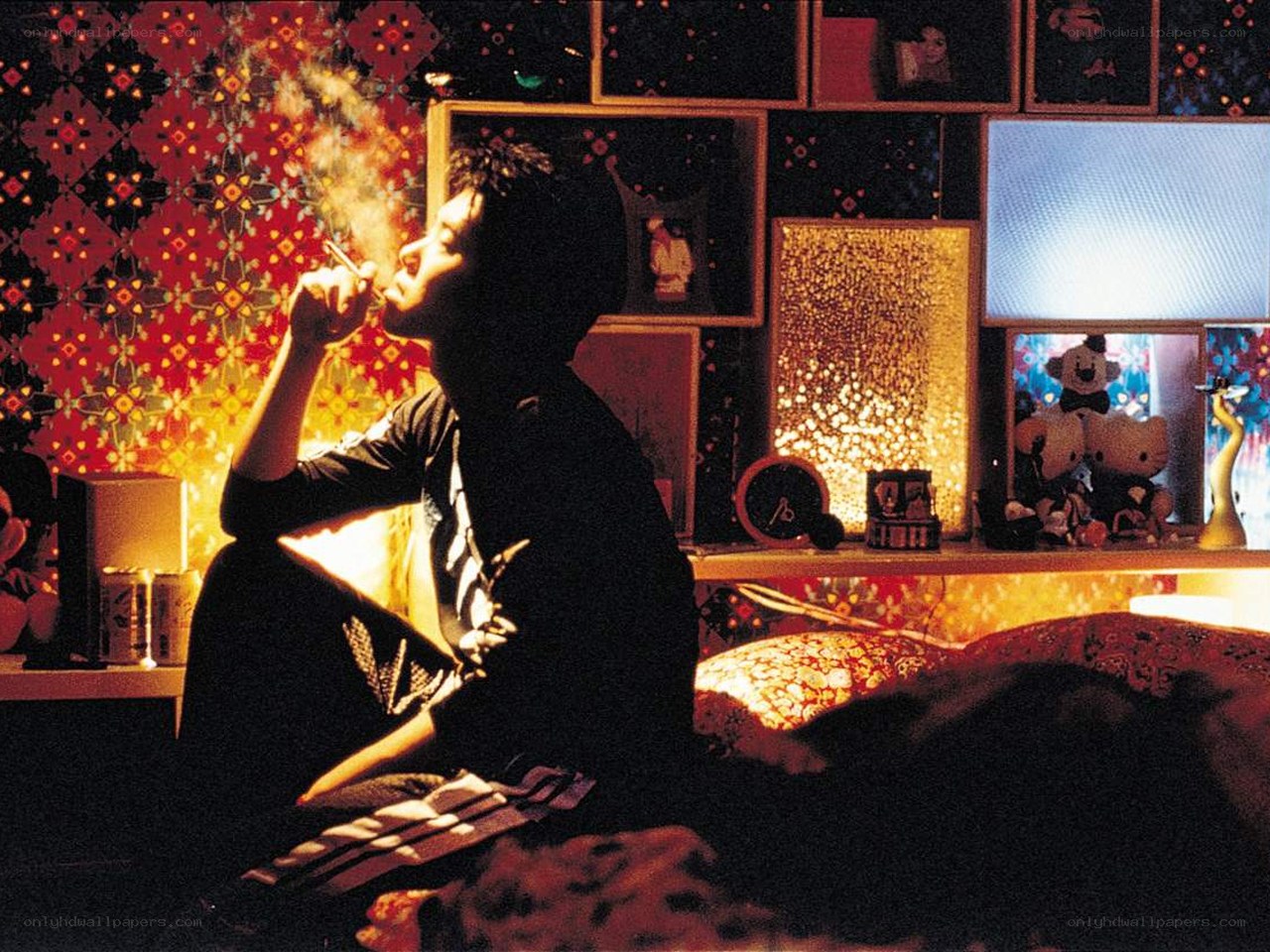 man smoking in a decorated room