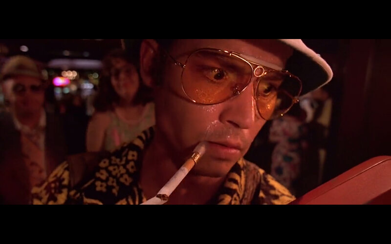 man smoking in crowd