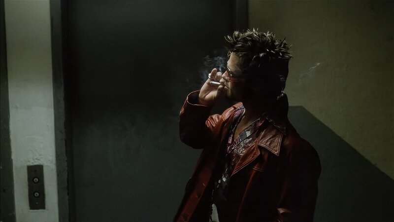 man smoking in elevator