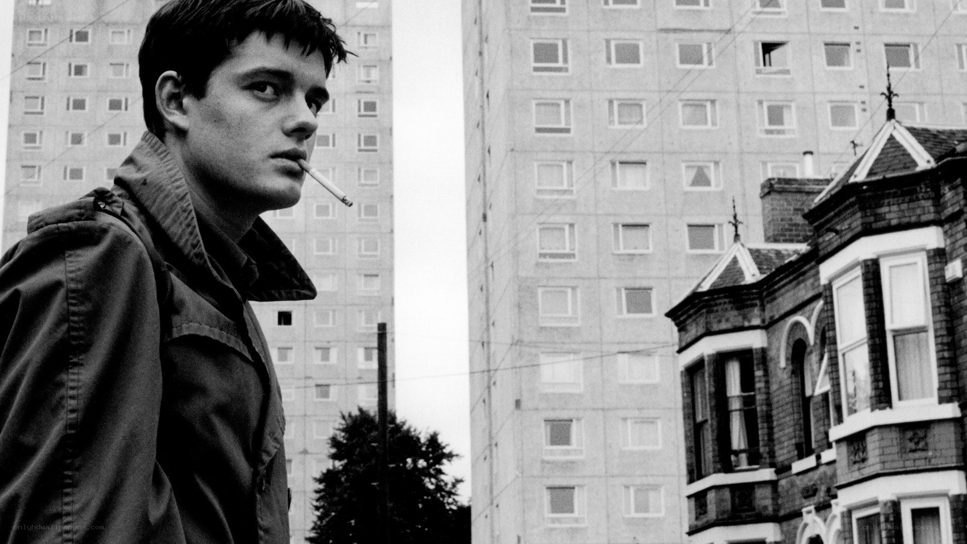 man smoking in urban setting