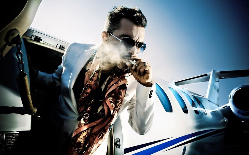 Man Smoking Near Airplane