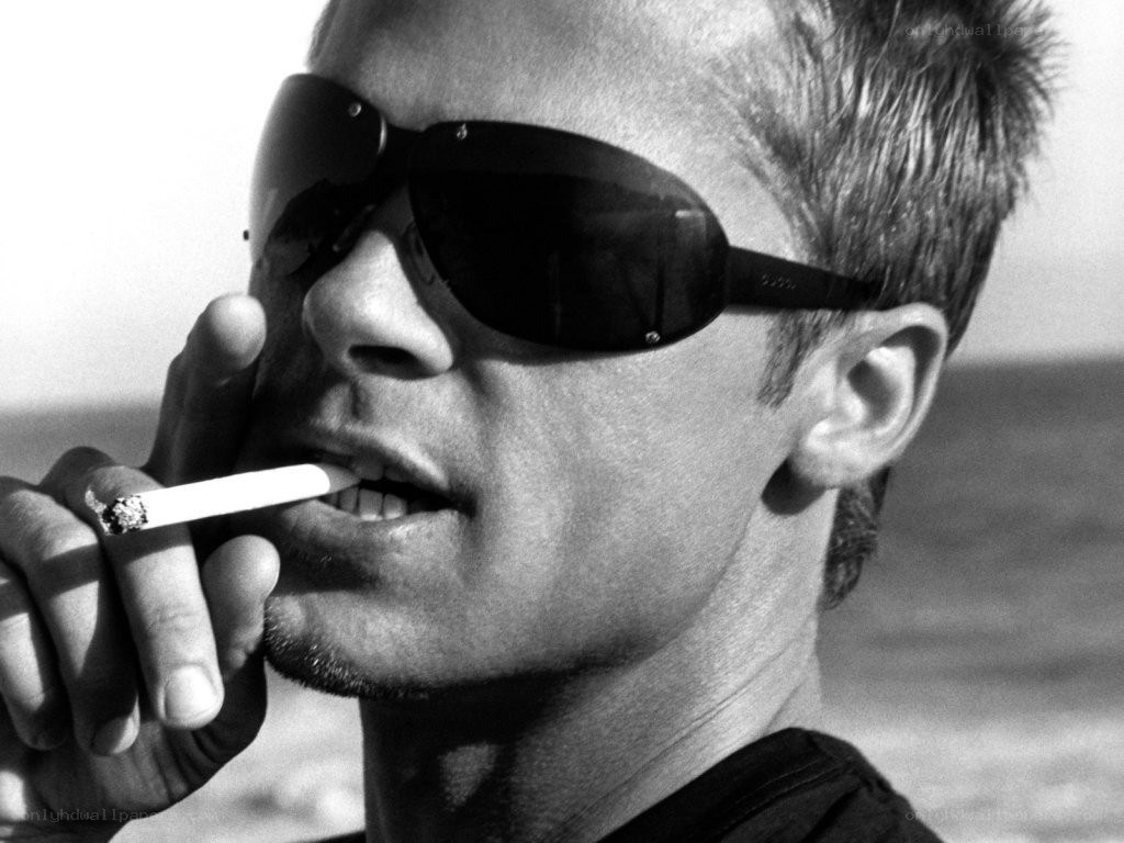 man smoking on beach