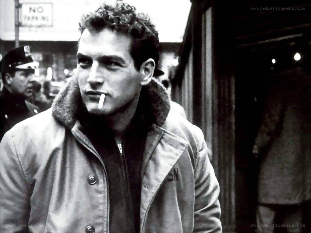 man smoking on city street