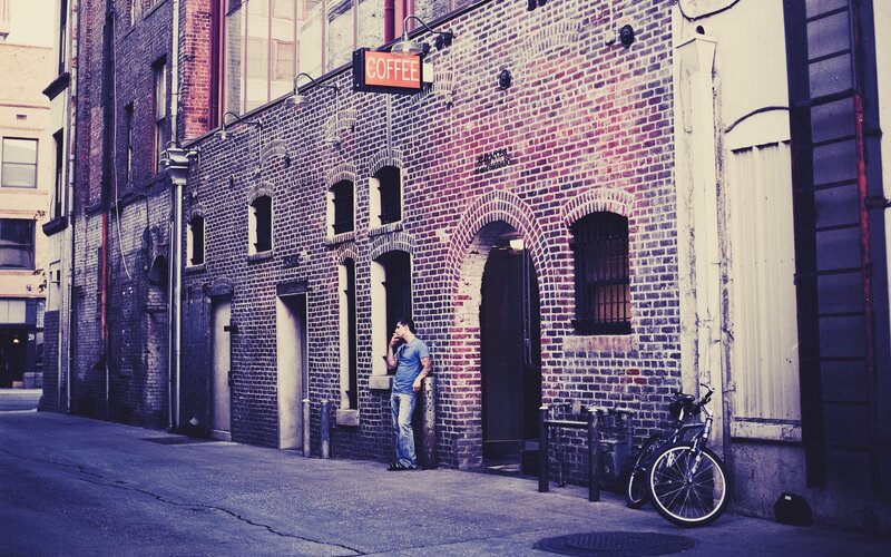 Man smoking outside coffee shop