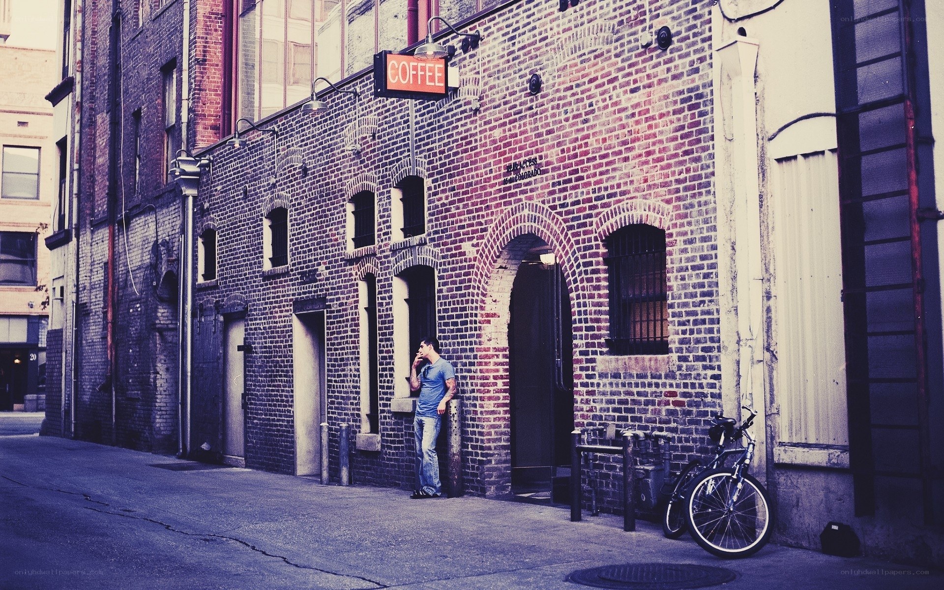 Man smoking outside coffee shop