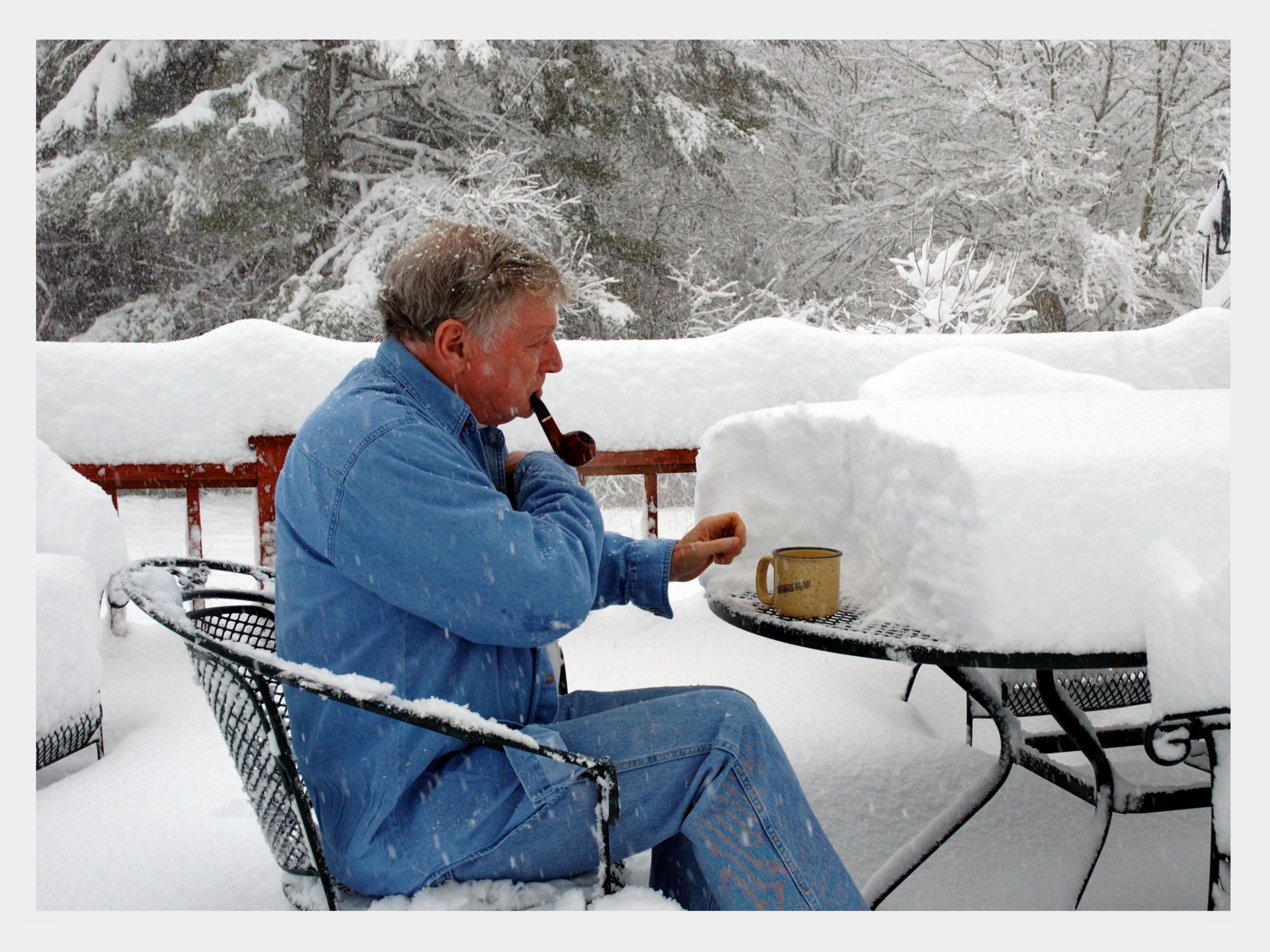 Man smoking pipe in snow