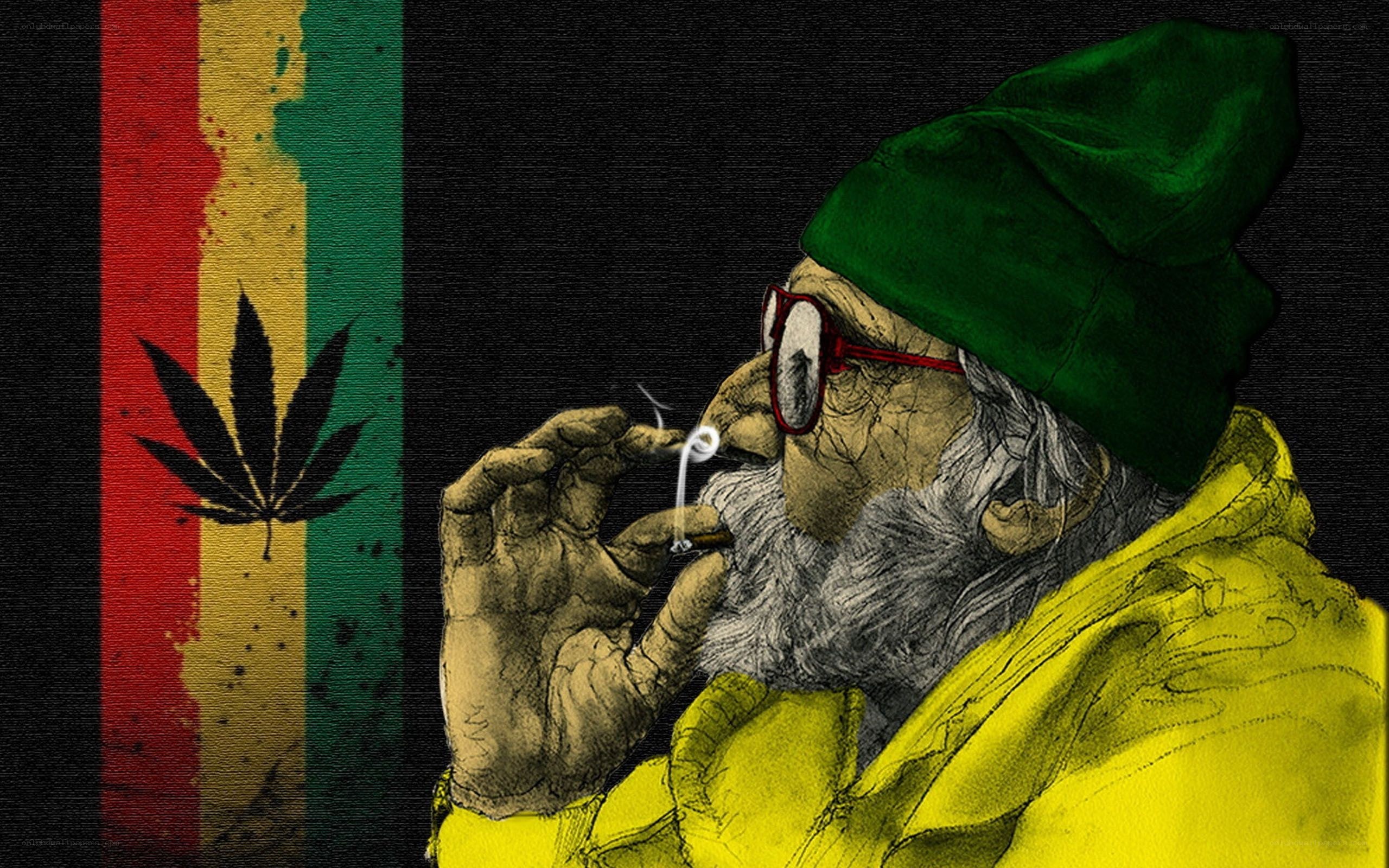 man smoking with rasta flag