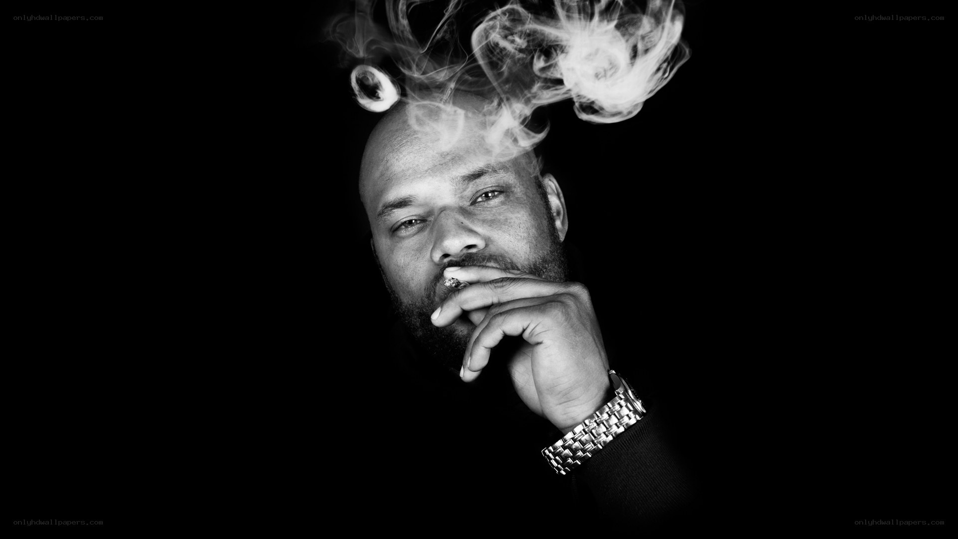 man smoking with smoke rings