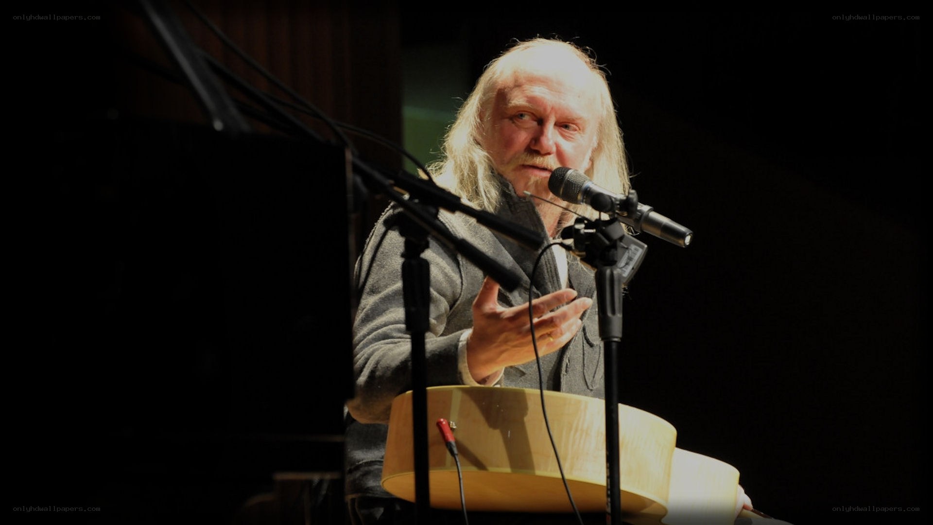 Man speaking at a microphone