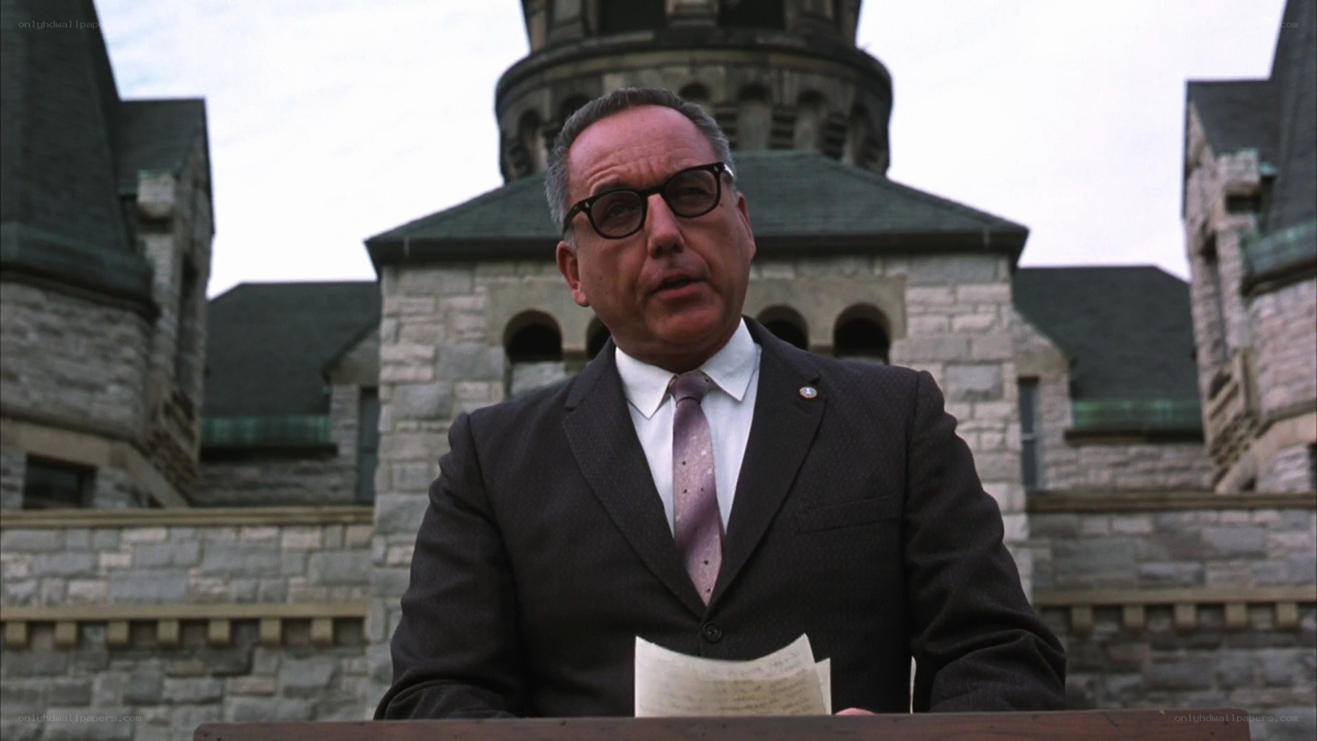 Man speaking at a podium