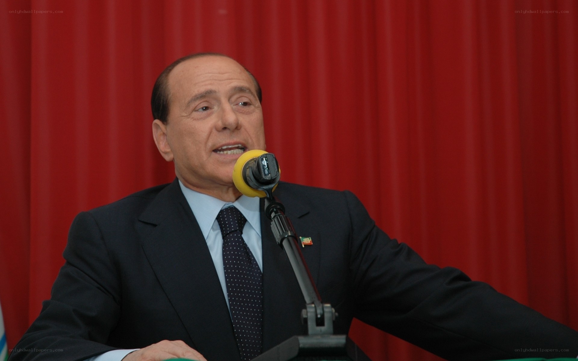 man speaking at a podium