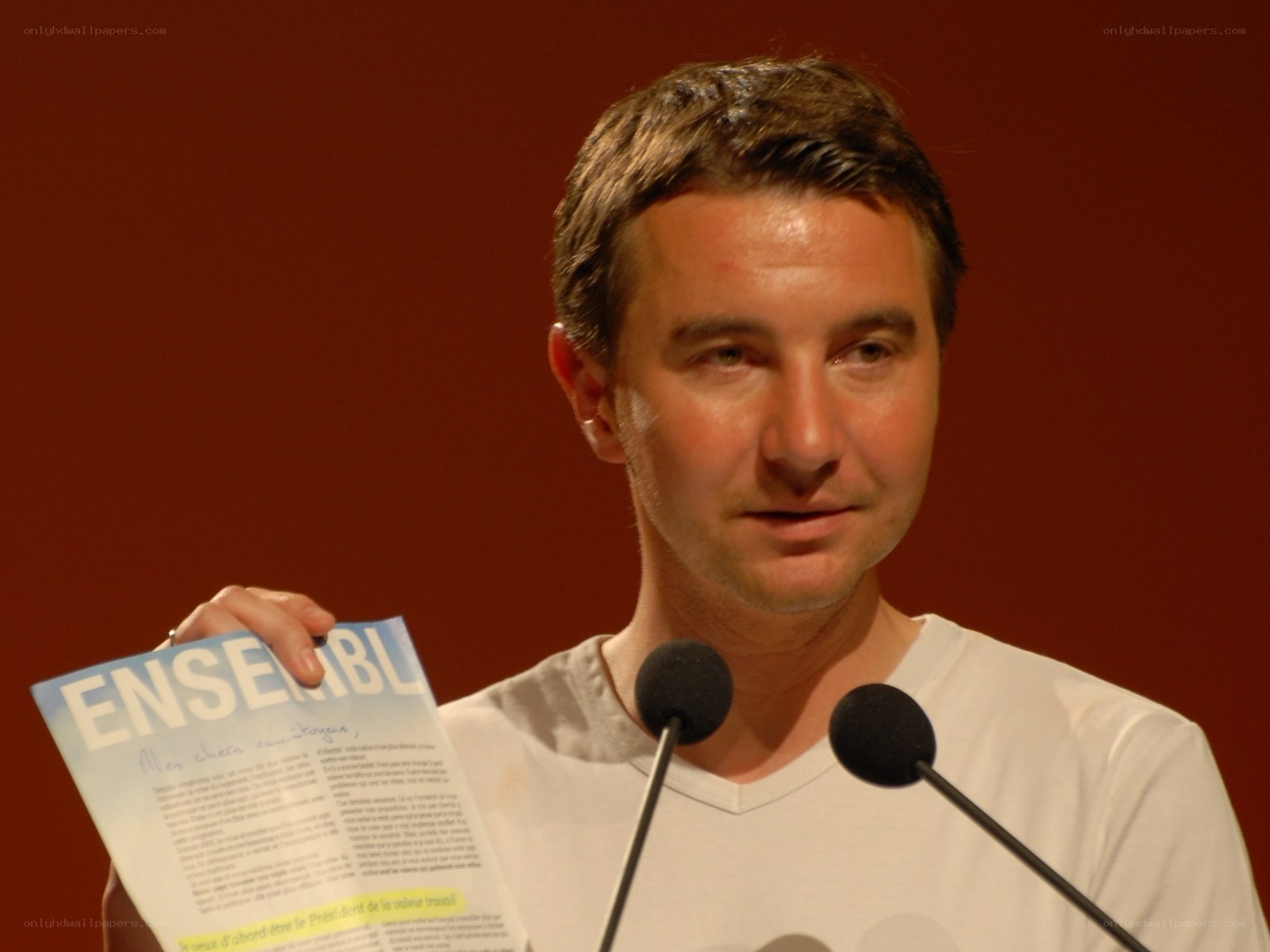 Man speaking at a podium