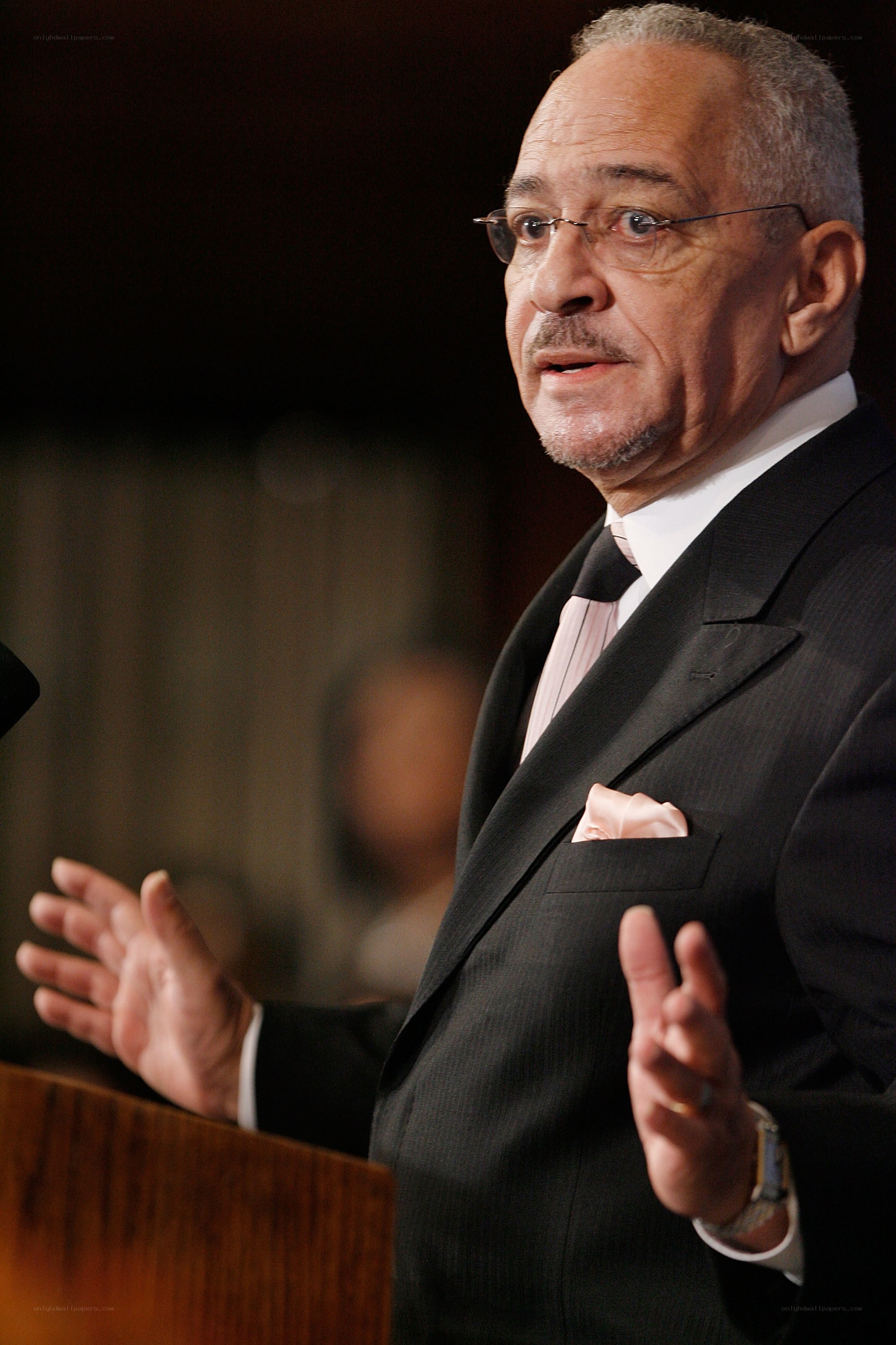 Man speaking at a podium