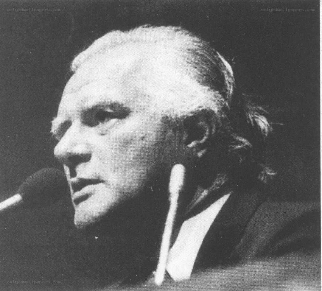 man speaking at a podium