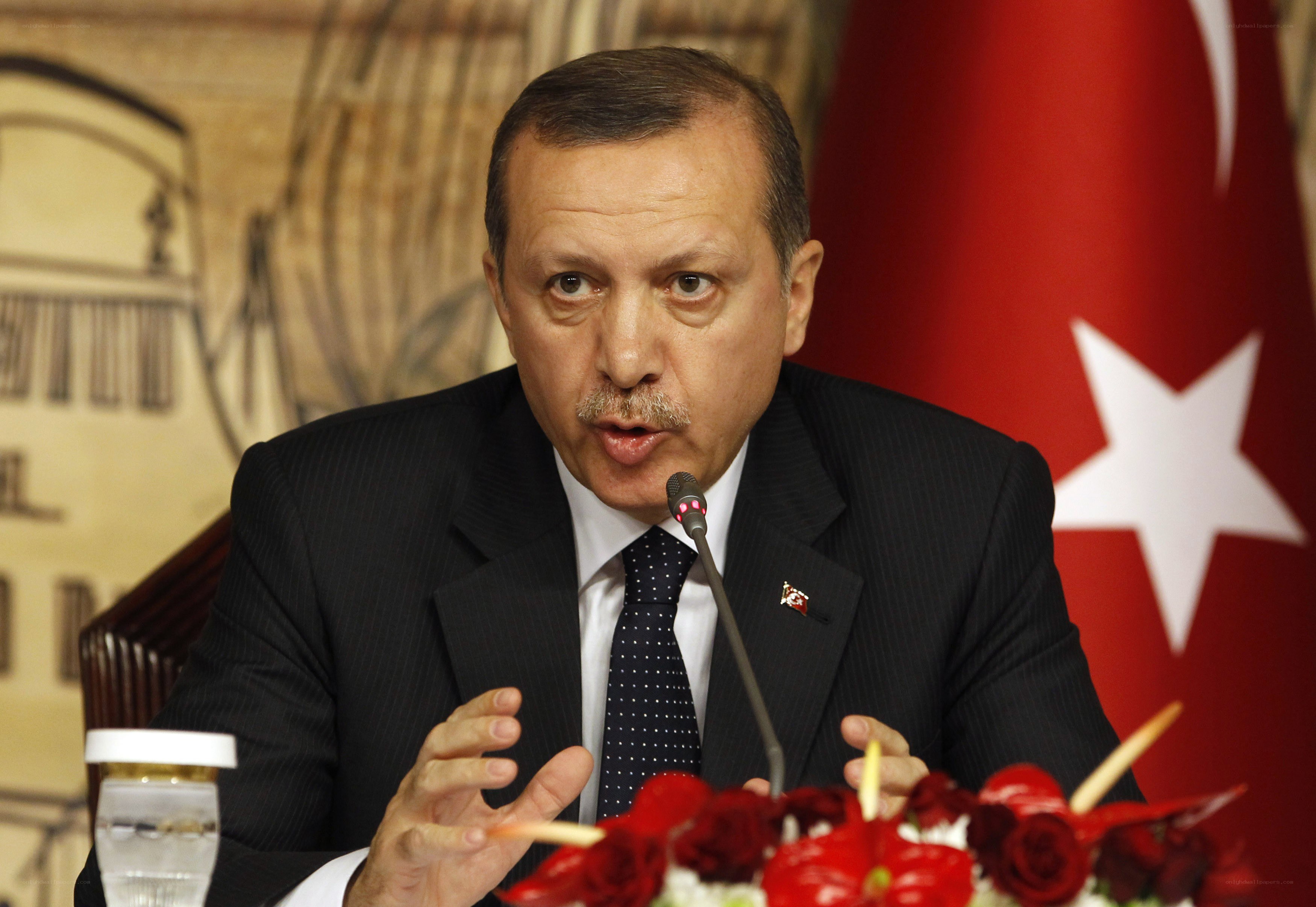 man speaking at a press conference