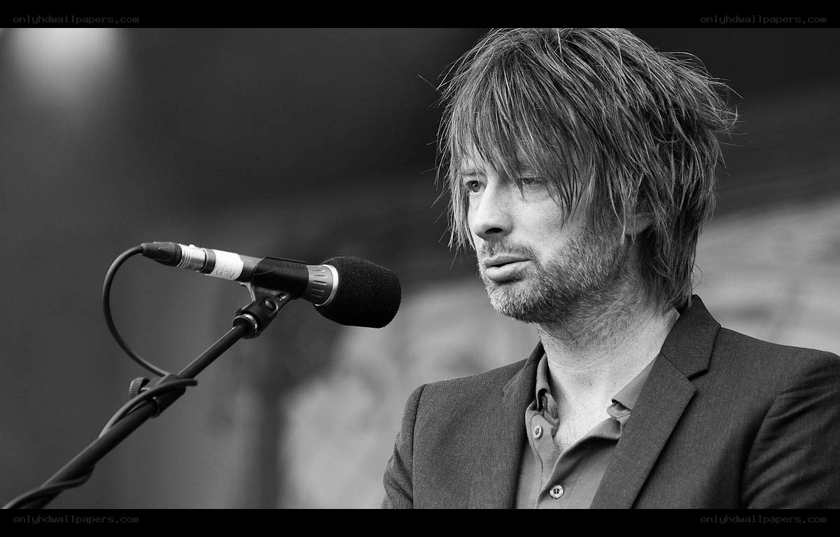 man speaking at microphone