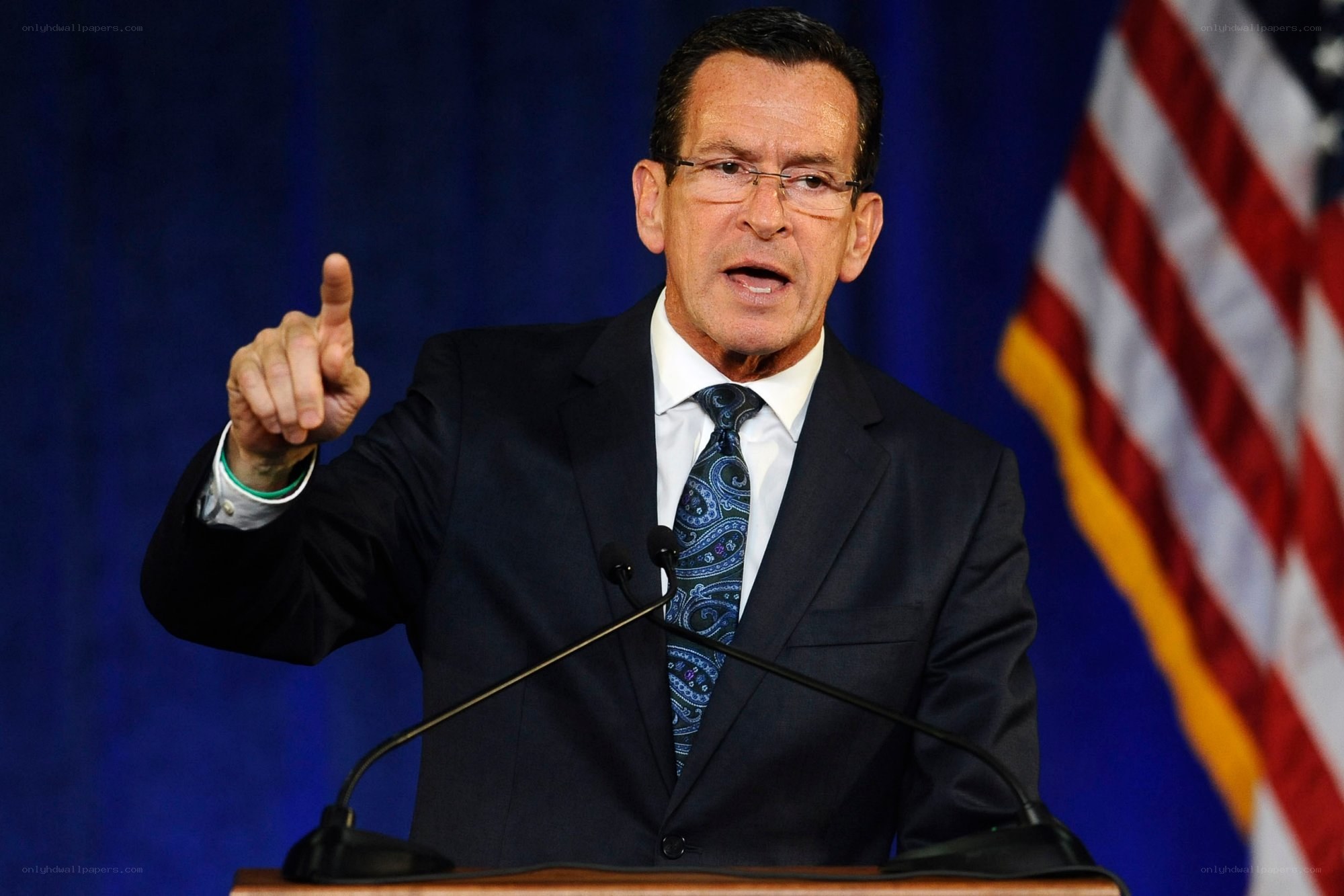 man speaking at podium