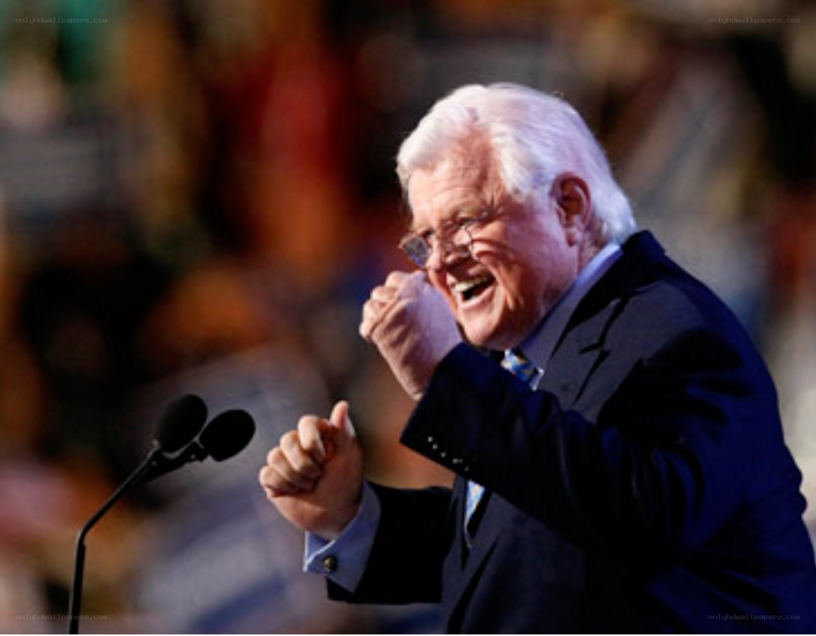 man speaking at podium