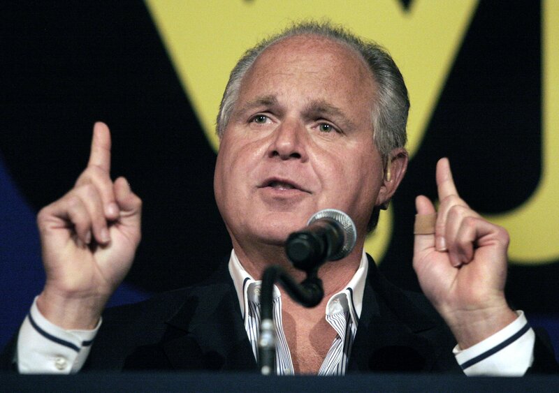 man speaking at podium