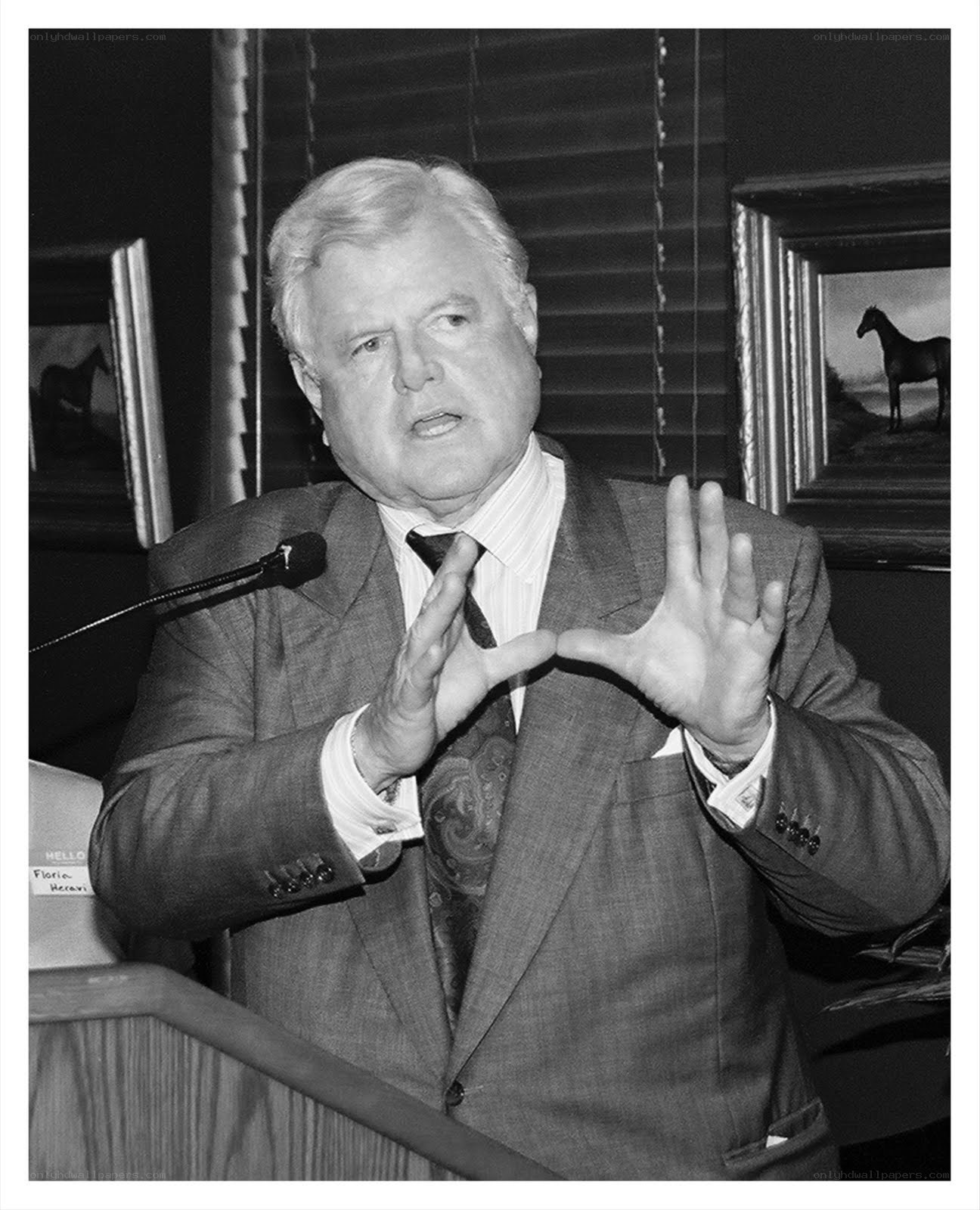 man speaking at podium