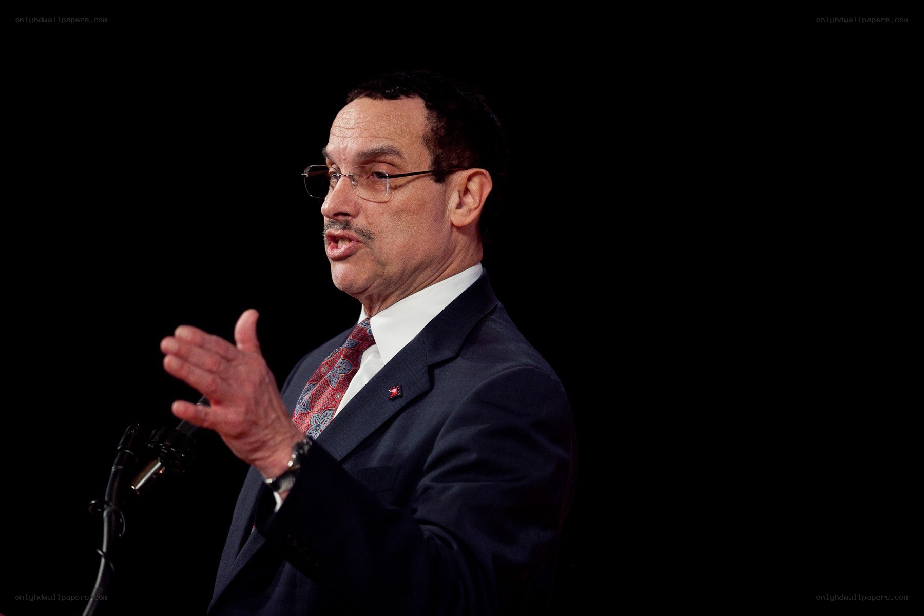 man speaking at podium