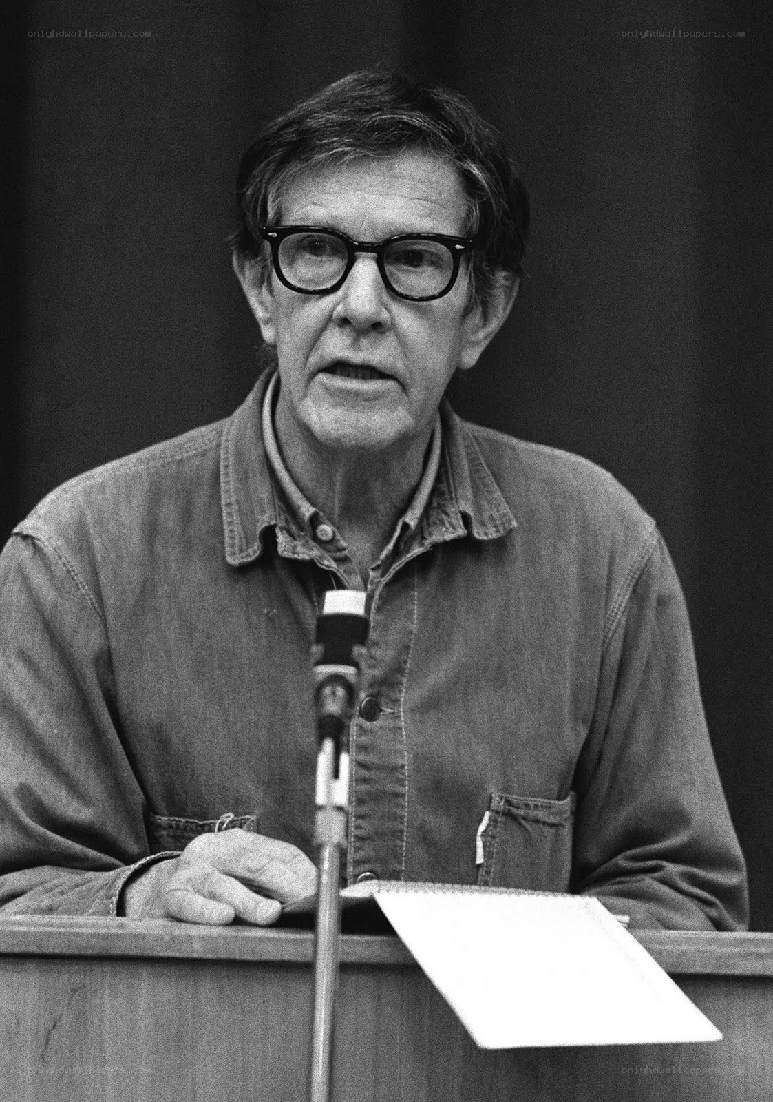 man speaking at podium
