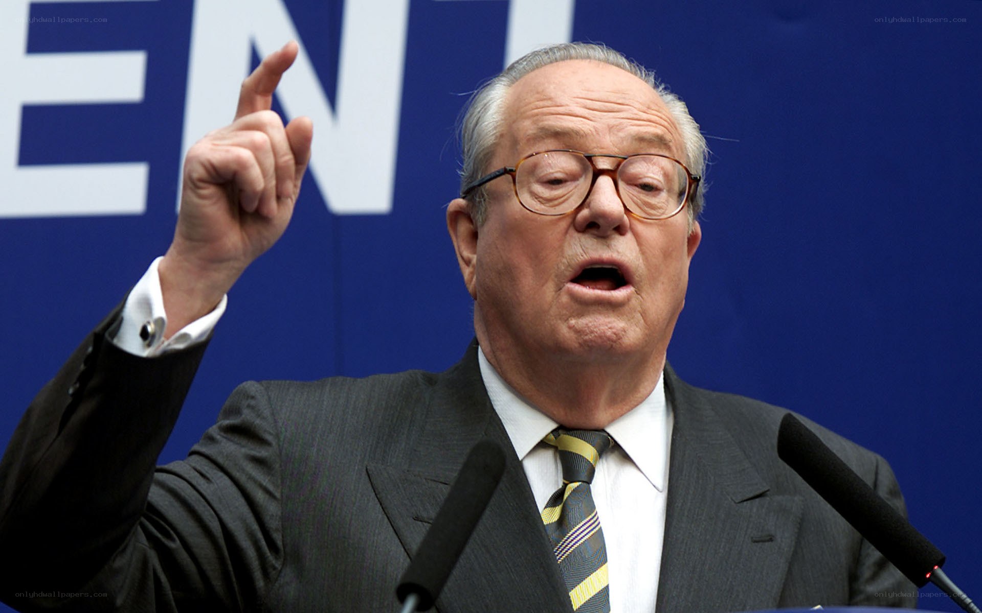 man speaking at podium