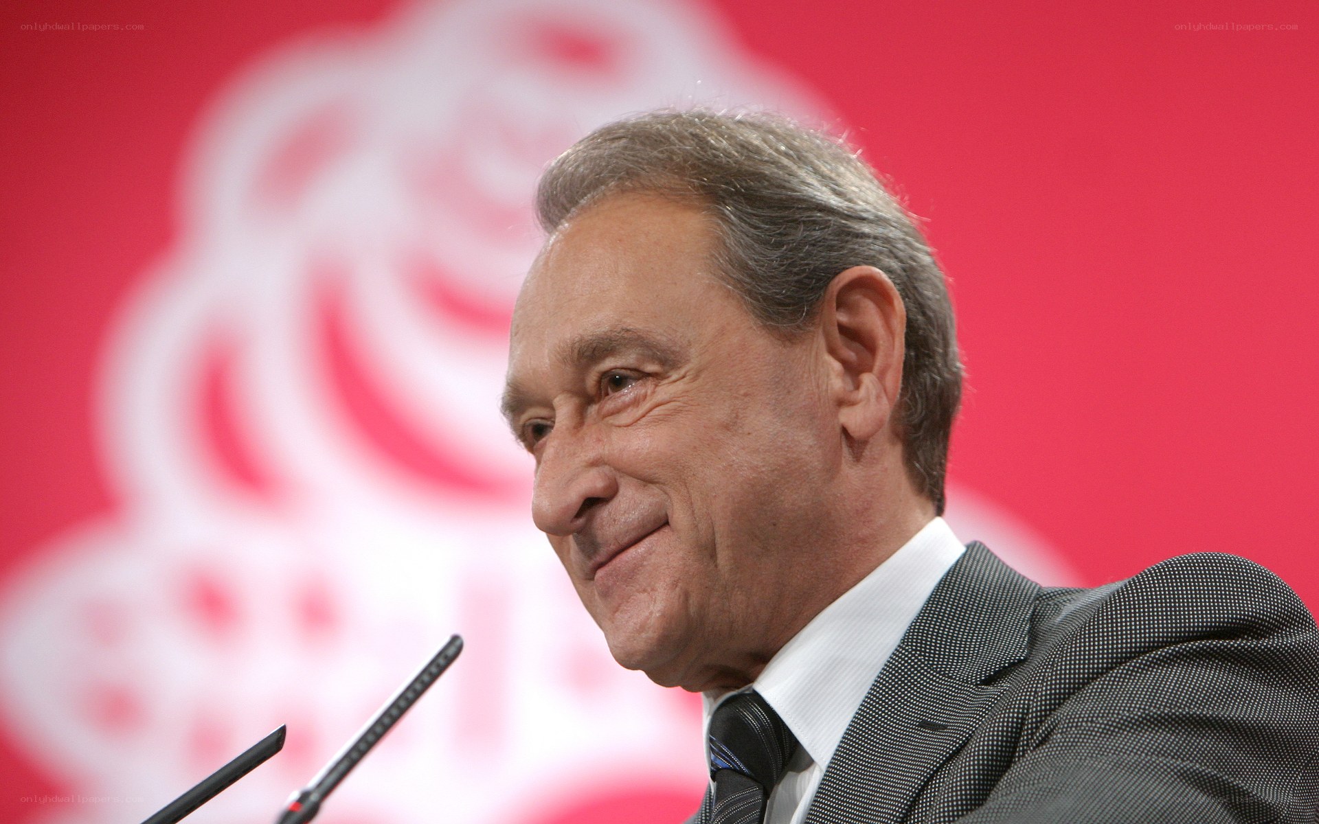 man speaking at podium