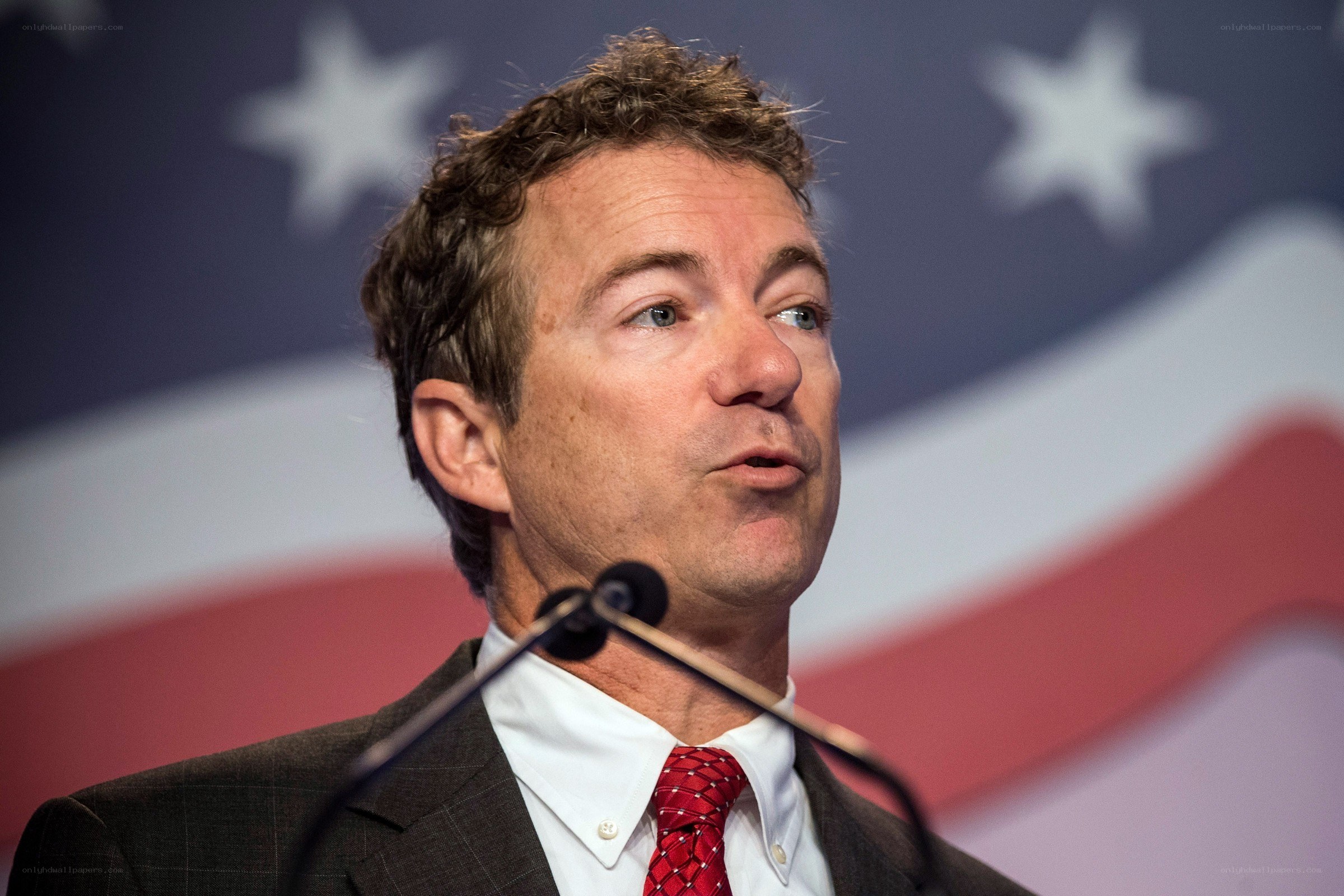man speaking at podium