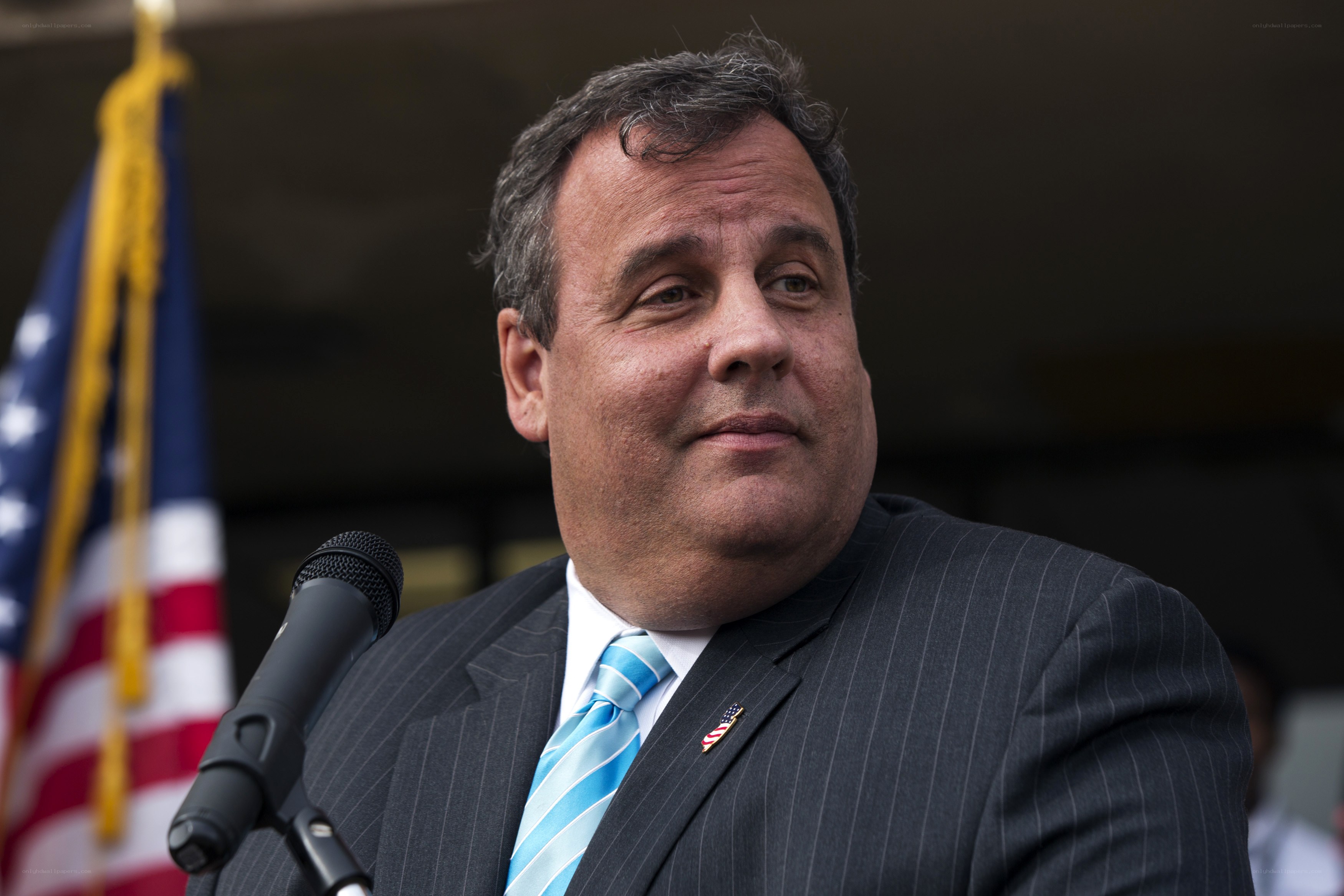 man speaking at podium