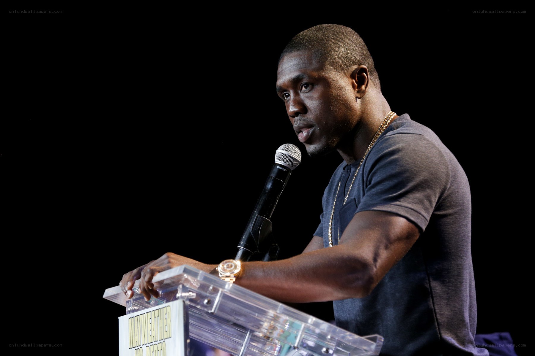 man speaking at podium