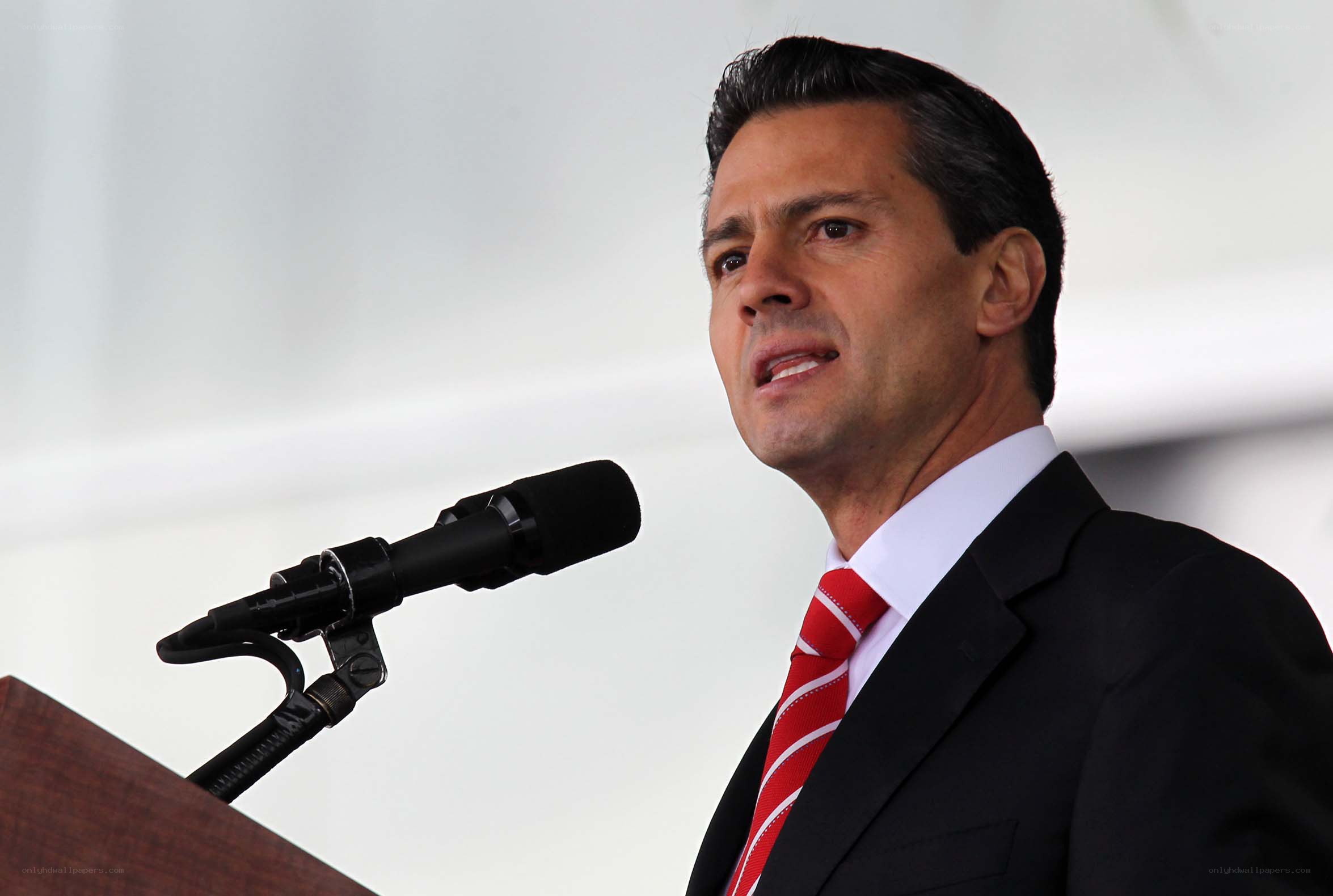man speaking at podium