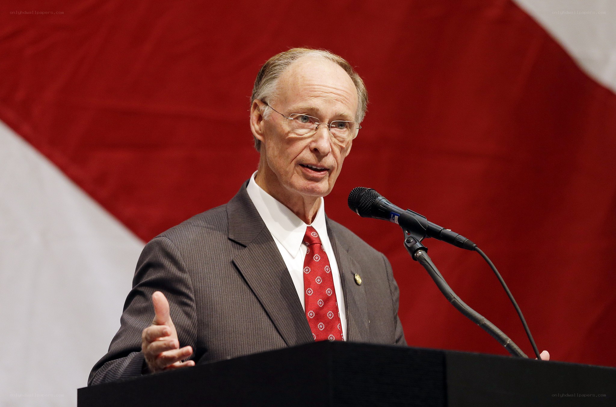 man speaking at podium
