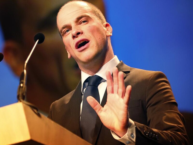 Man Speaking at Podium — Blue, Formal