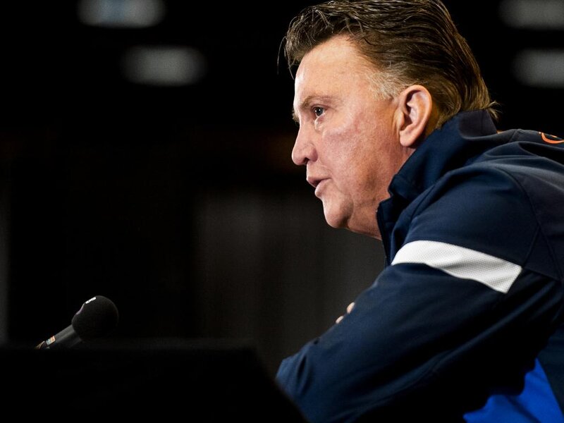 Man Speaking at Podium — Blue
