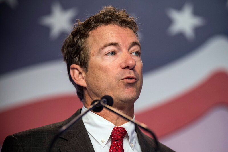 Man Speaking at Podium — Red