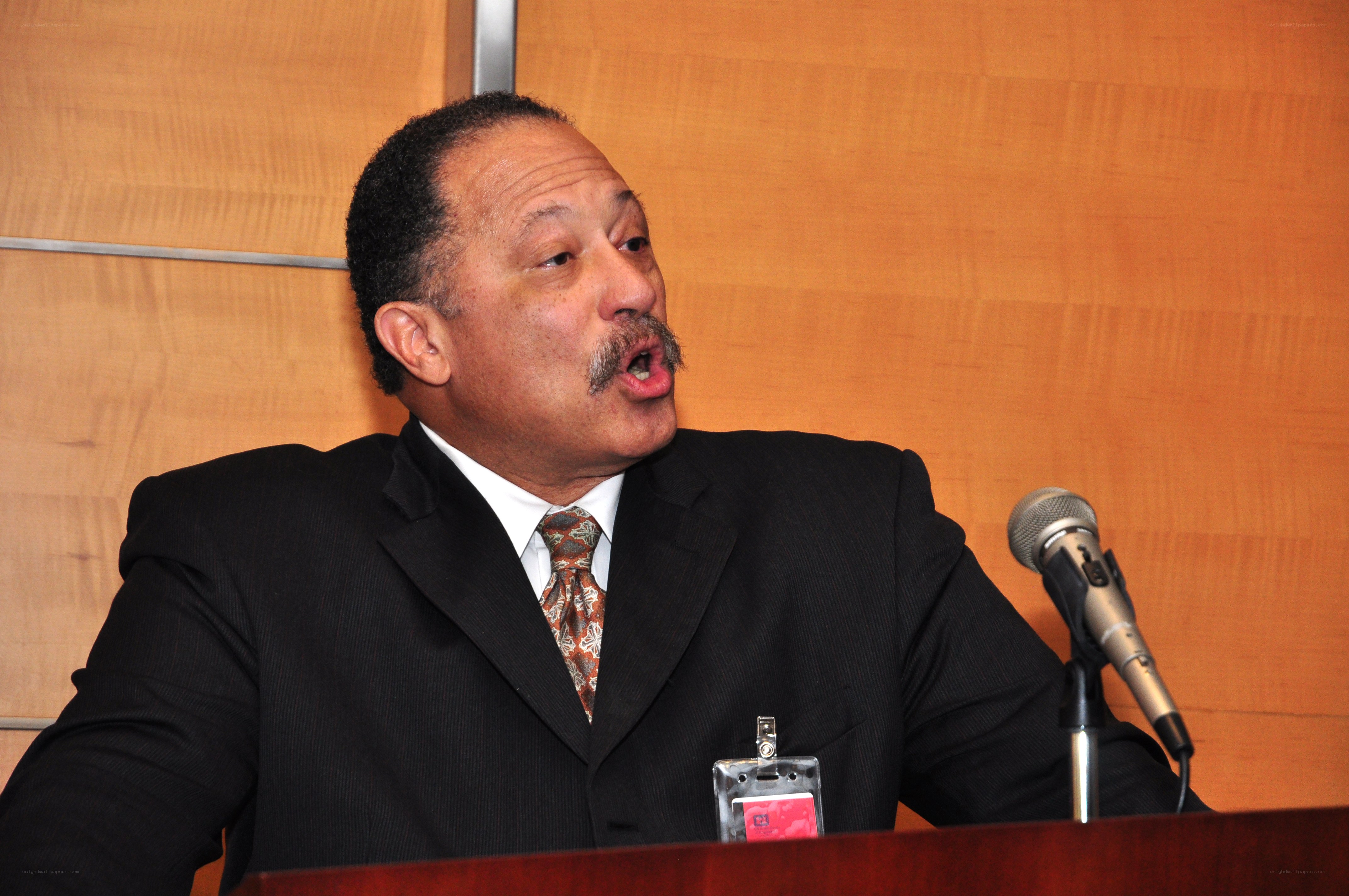 man speaking at podium