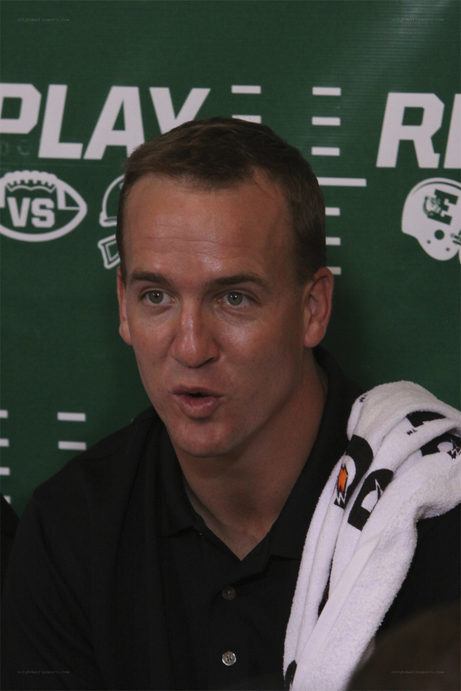 man speaking at press conference