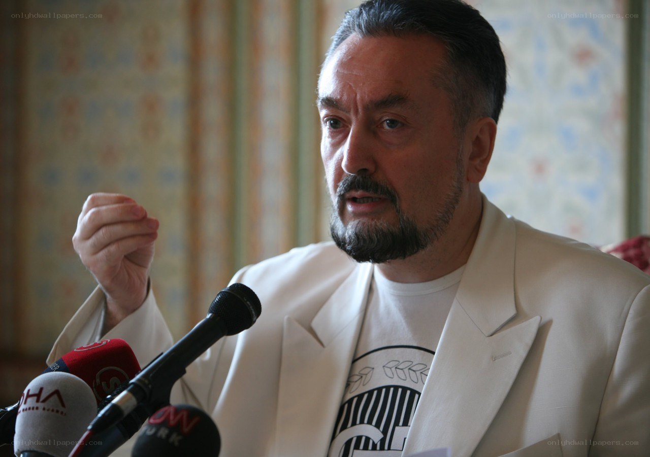 man speaking at press conference
