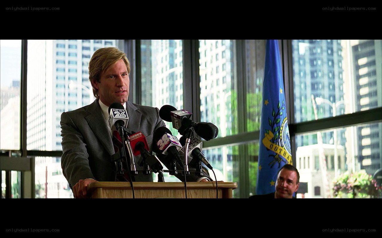man speaking at press conference