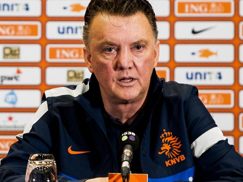 Man Speaking at Press Conference — Blue