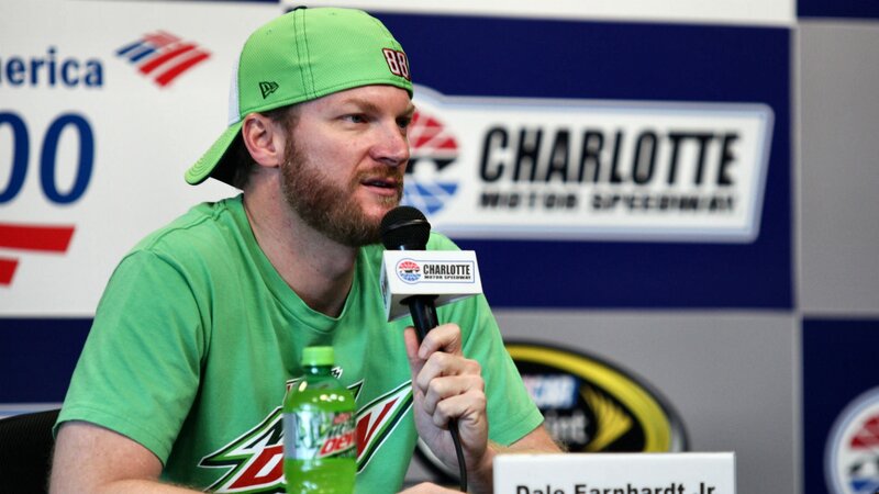 Man Speaking at Press Conference — Green