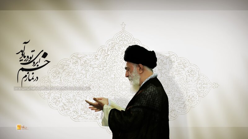 Man speaking in front of calligraphy