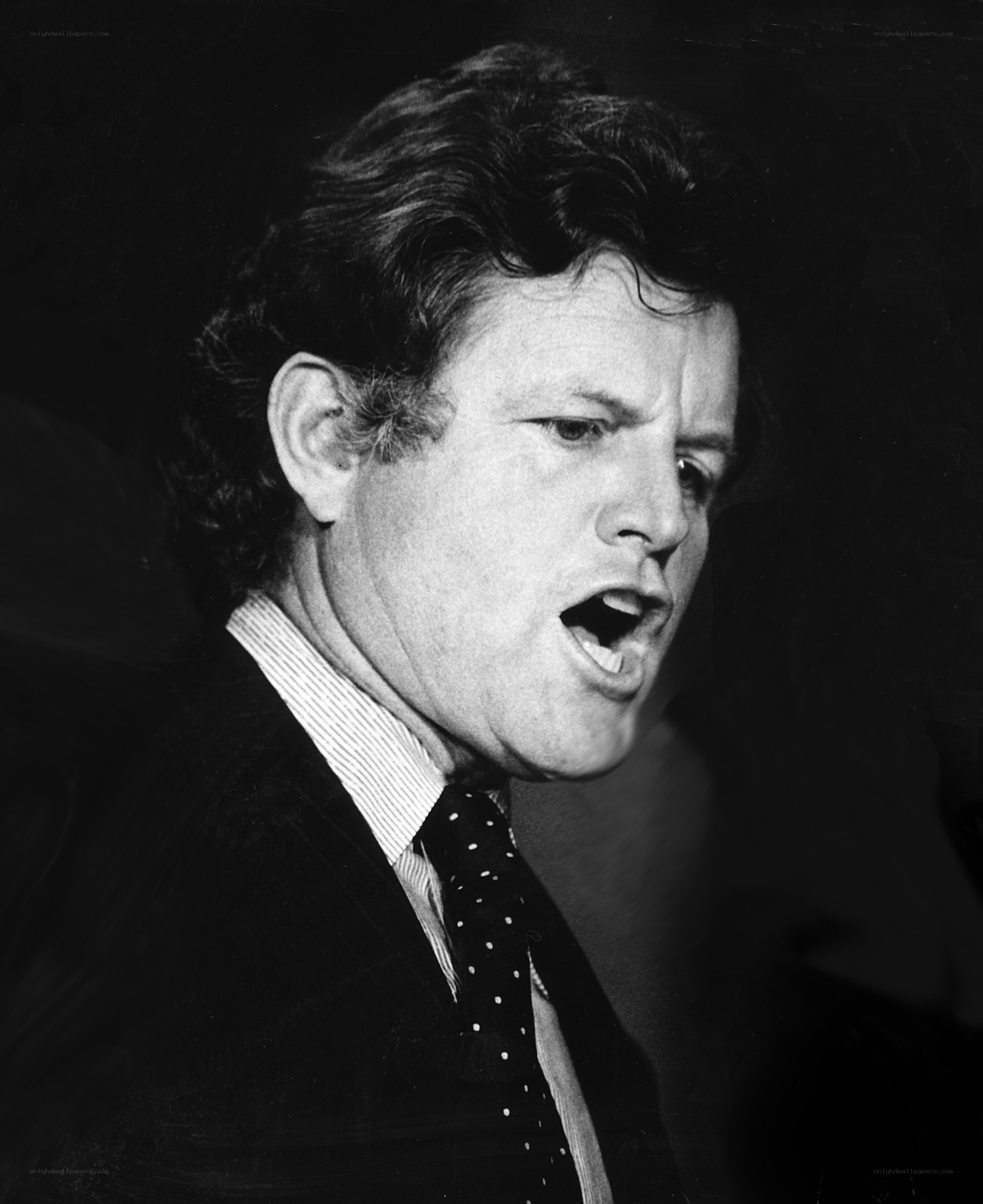 man speaking in suit