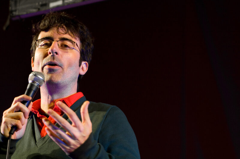 man speaking into microphone